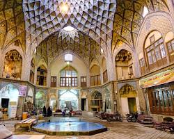 Vibrant bazaar in Kashan with colorful shops and traditional Persian goods